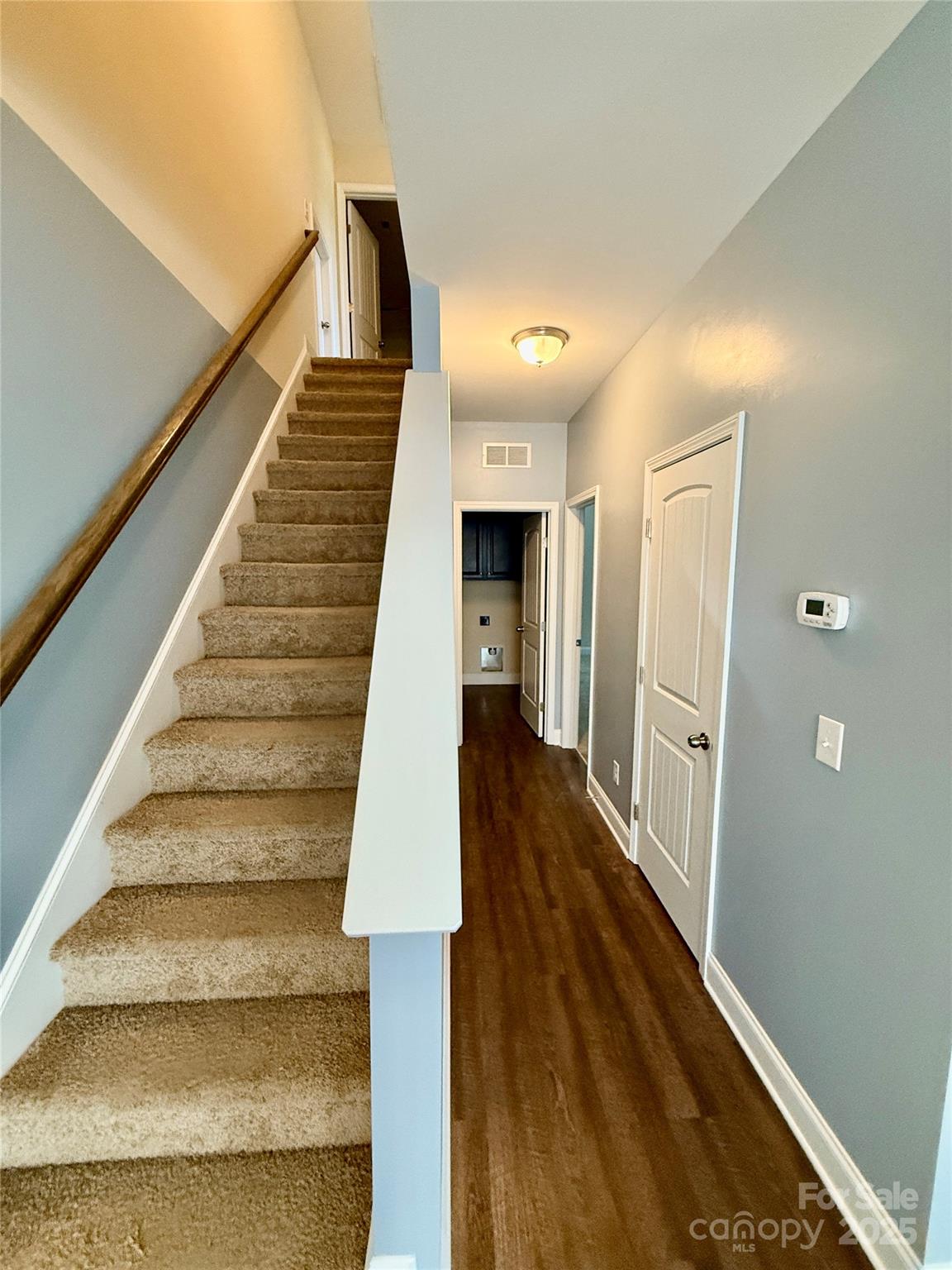 4048 Avis Way Monroe, NC 28110 - Photo 9 of 23 a view of entryway and hall with wooden floor
