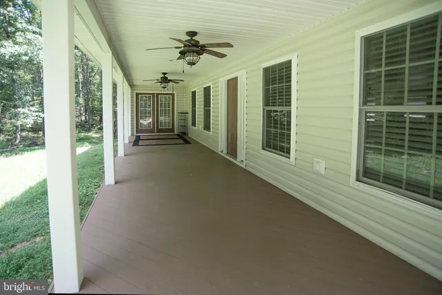 a view of a porch with seating space