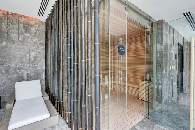 a living room filled with furniture and a chandelier