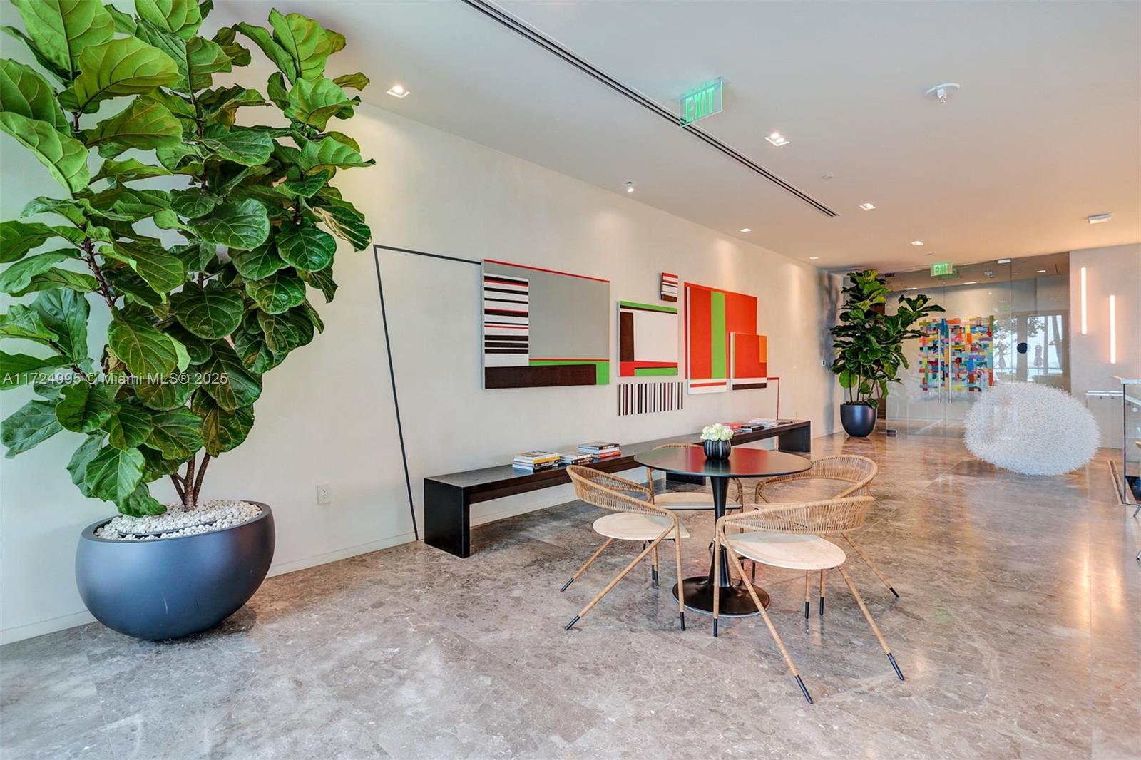 650 Northeast 32nd Street, Unit 1008 Miami, FL 33137 - Photo 29 of 57 a living room with furniture a potted plant and wooden floor