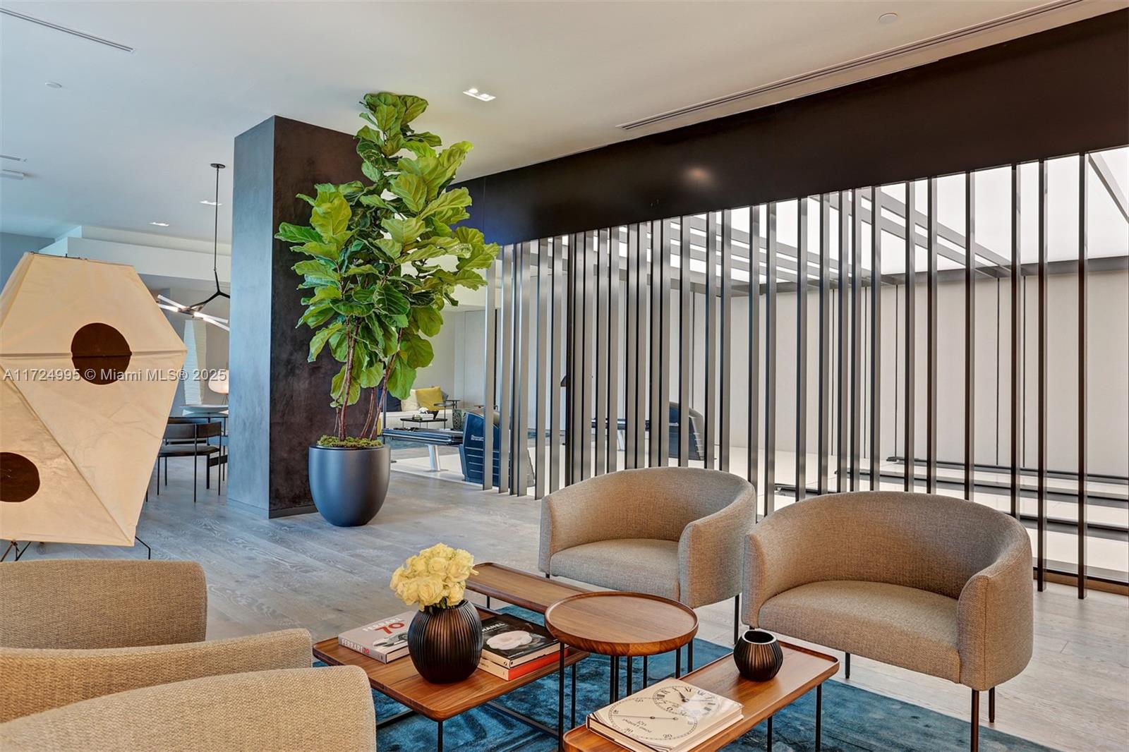 650 Northeast 32nd Street, Unit 1008 Miami, FL 33137 - Photo 44 of 57 a living room with furniture and a potted plant