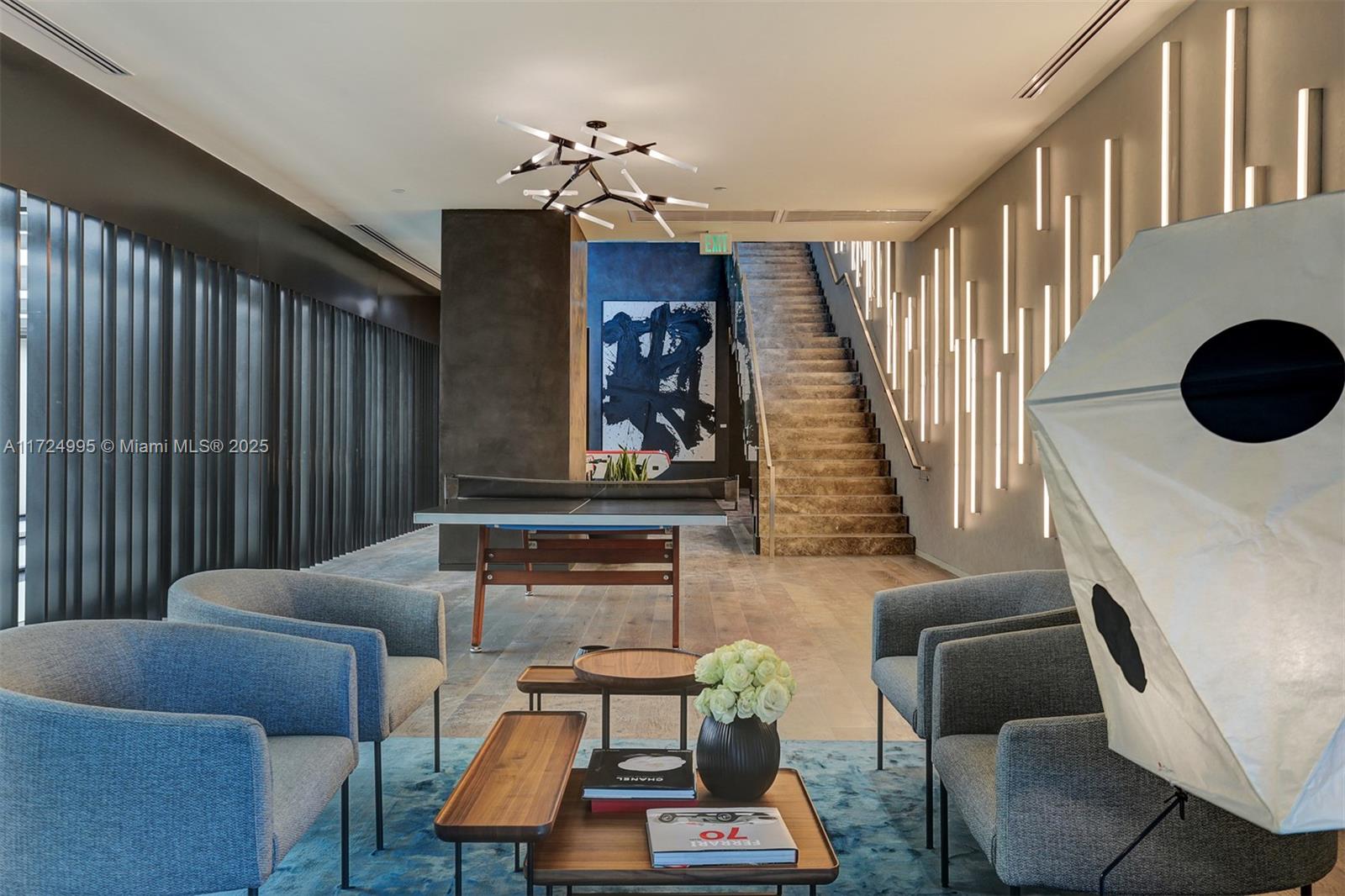 650 Northeast 32nd Street, Unit 1008 Miami, FL 33137 - Photo 45 of 57 a living room with furniture and a chandelier