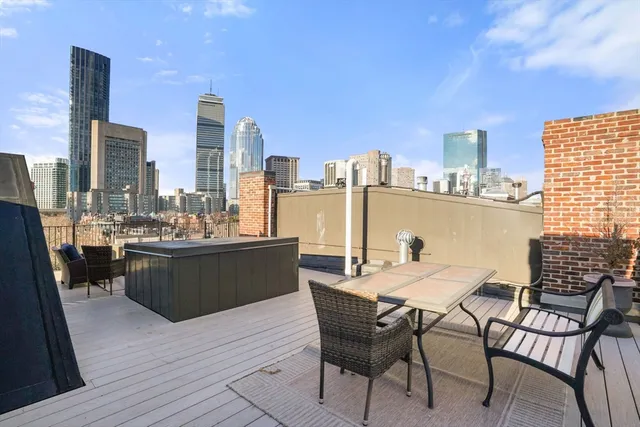 a view of a balcony with chairs