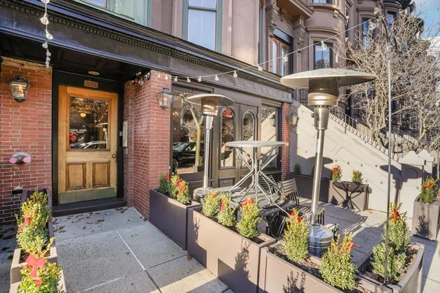 a view of a building with sitting area