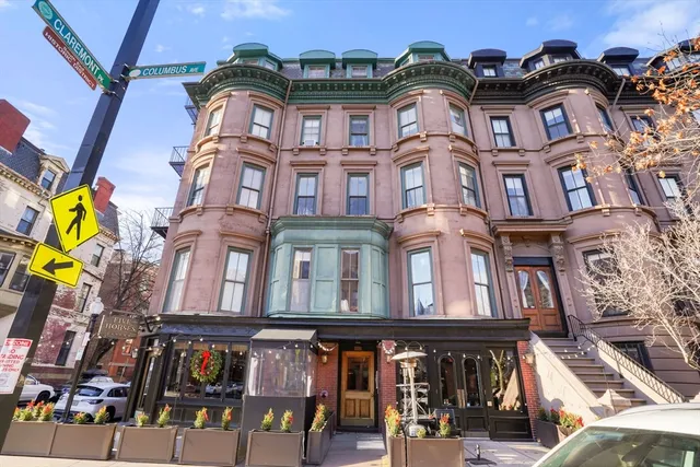 a front view of a multi story residential apartment building