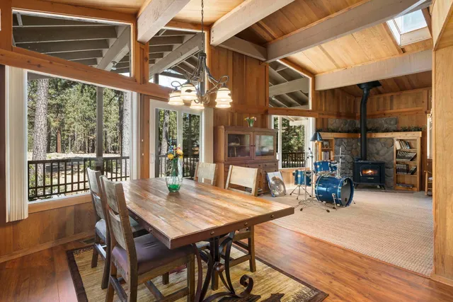 a view of a patio with a table and chairs