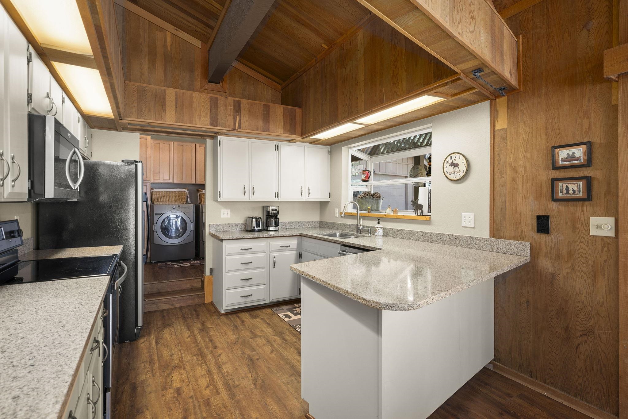 6 Hokan Trail Graeagle, CA 96103 - Photo 14 of 28 a kitchen with a sink stove and refrigerator