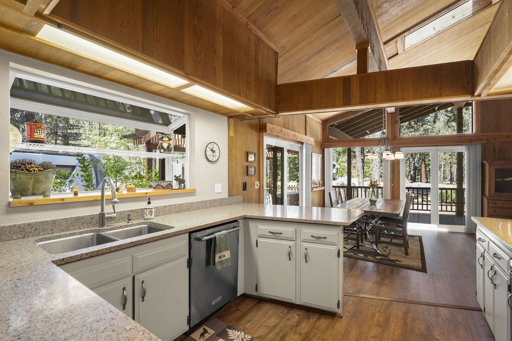 6 Hokan Trail Graeagle, CA 96103 - Photo 16 of 28 a large kitchen with stainless steel appliances granite countertop a sink and cabinets