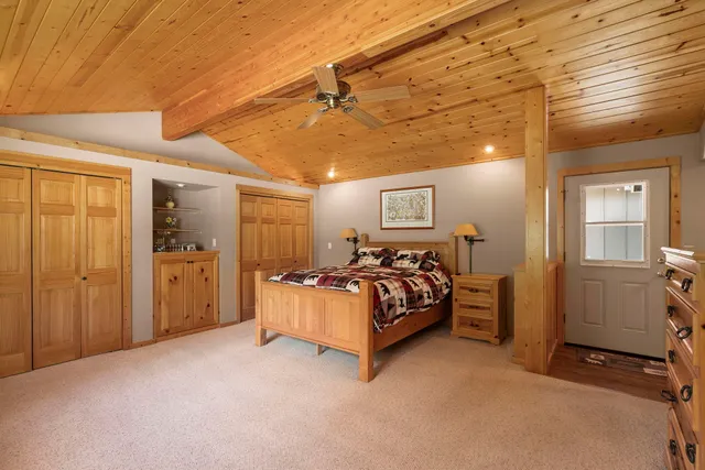 a bed room with a bed and a window