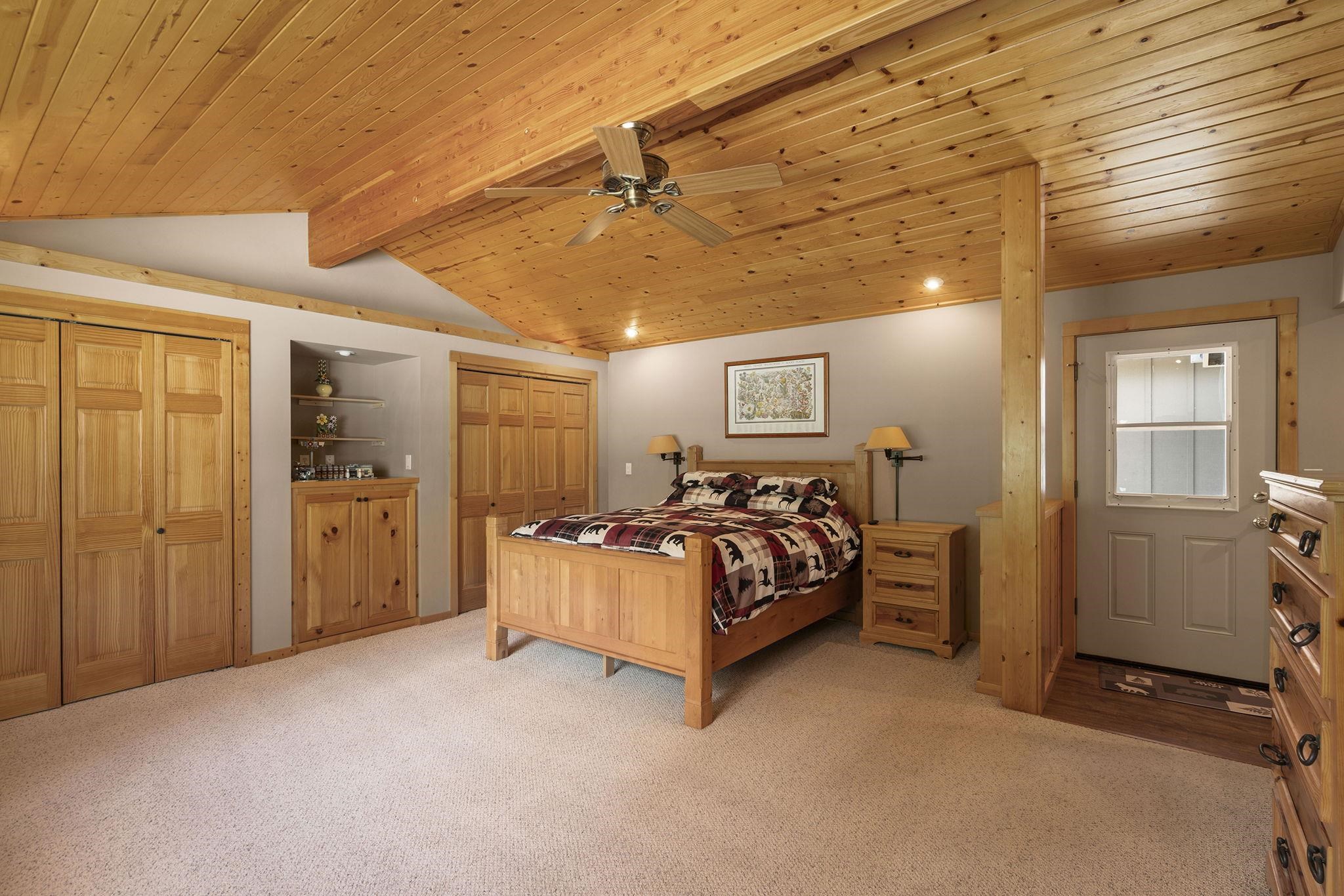 6 Hokan Trail Graeagle, CA 96103 - Photo 17 of 28 a bed room with a bed and a window