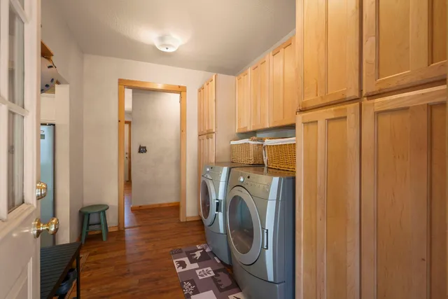 a view of a hallway with washer and dryer
