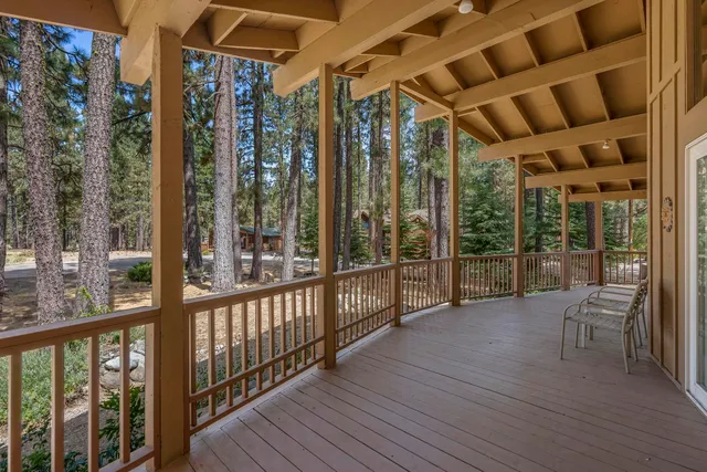 a view of porch with wooden floor
