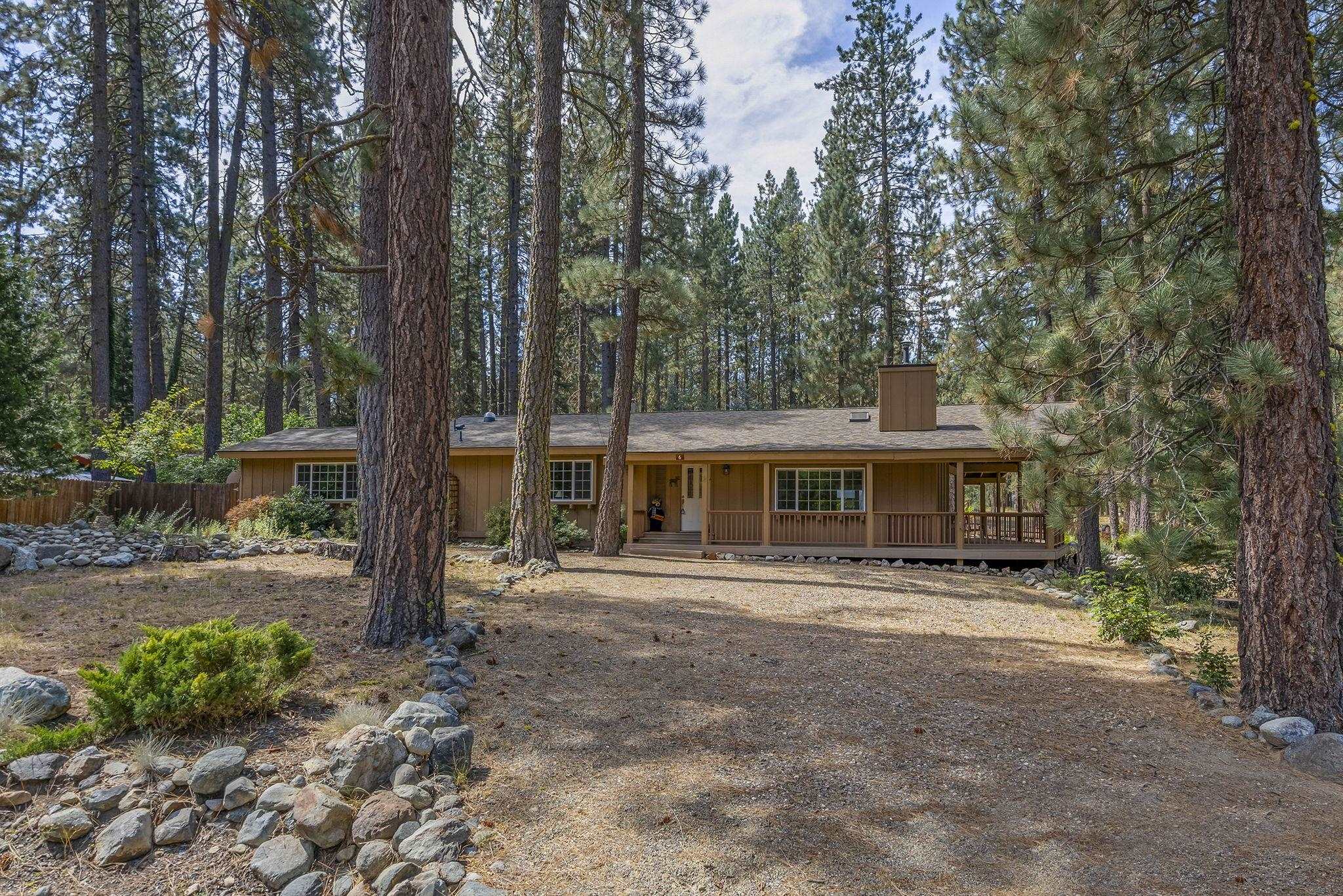 6 Hokan Trail Graeagle, CA 96103 - Photo 3 of 28 a front view of a house with a garden