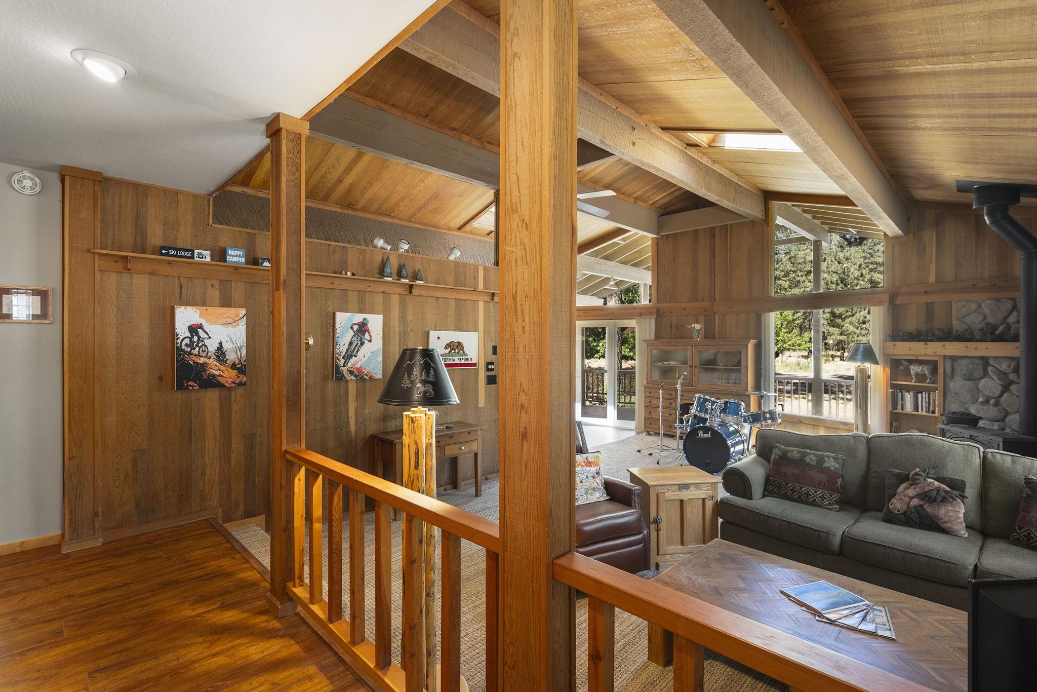 6 Hokan Trail Graeagle, CA 96103 - Photo 6 of 28 a living room with furniture wooden floor and a large window