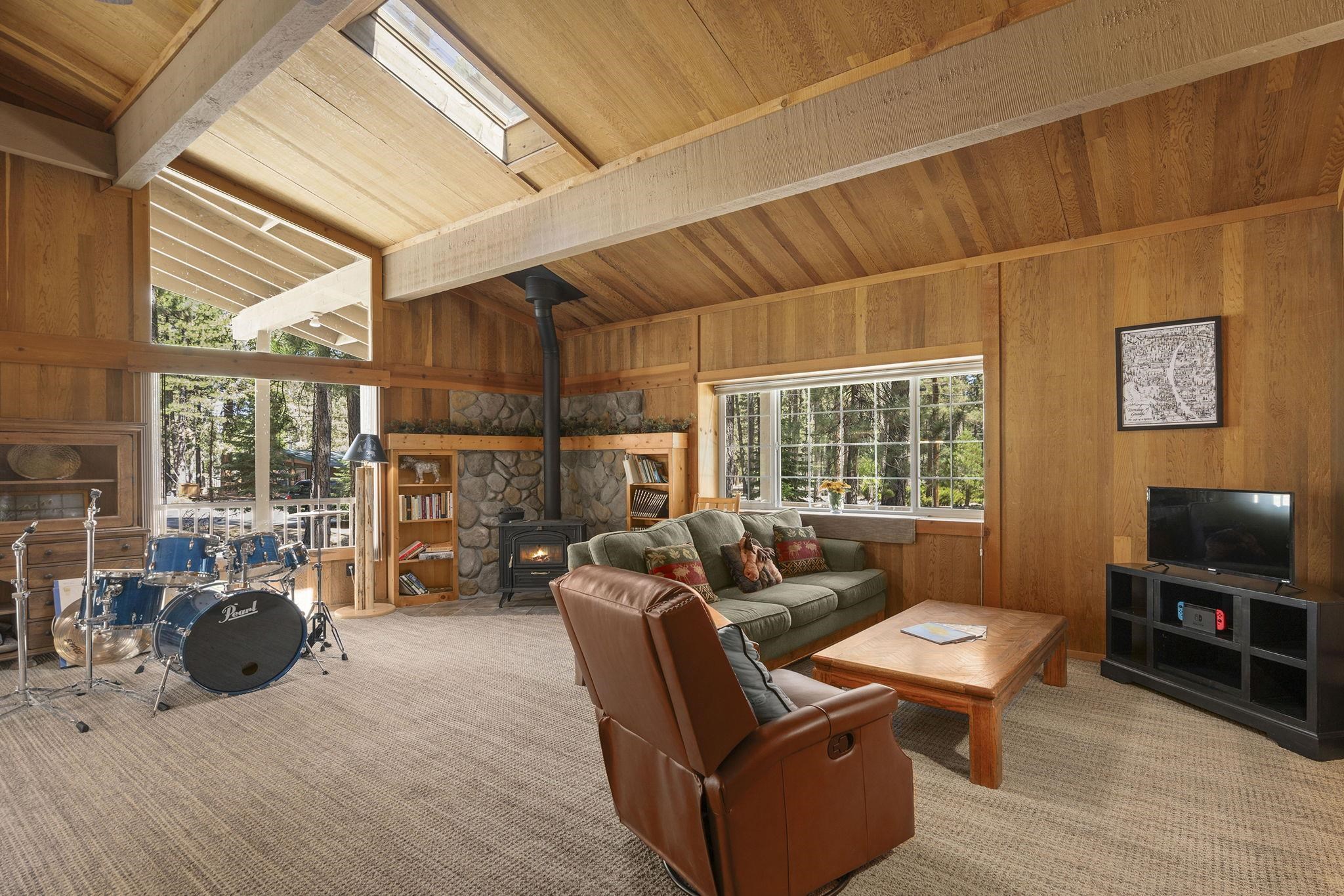 6 Hokan Trail Graeagle, CA 96103 - Photo 7 of 28 a living room with furniture a rug and a floor to ceiling window