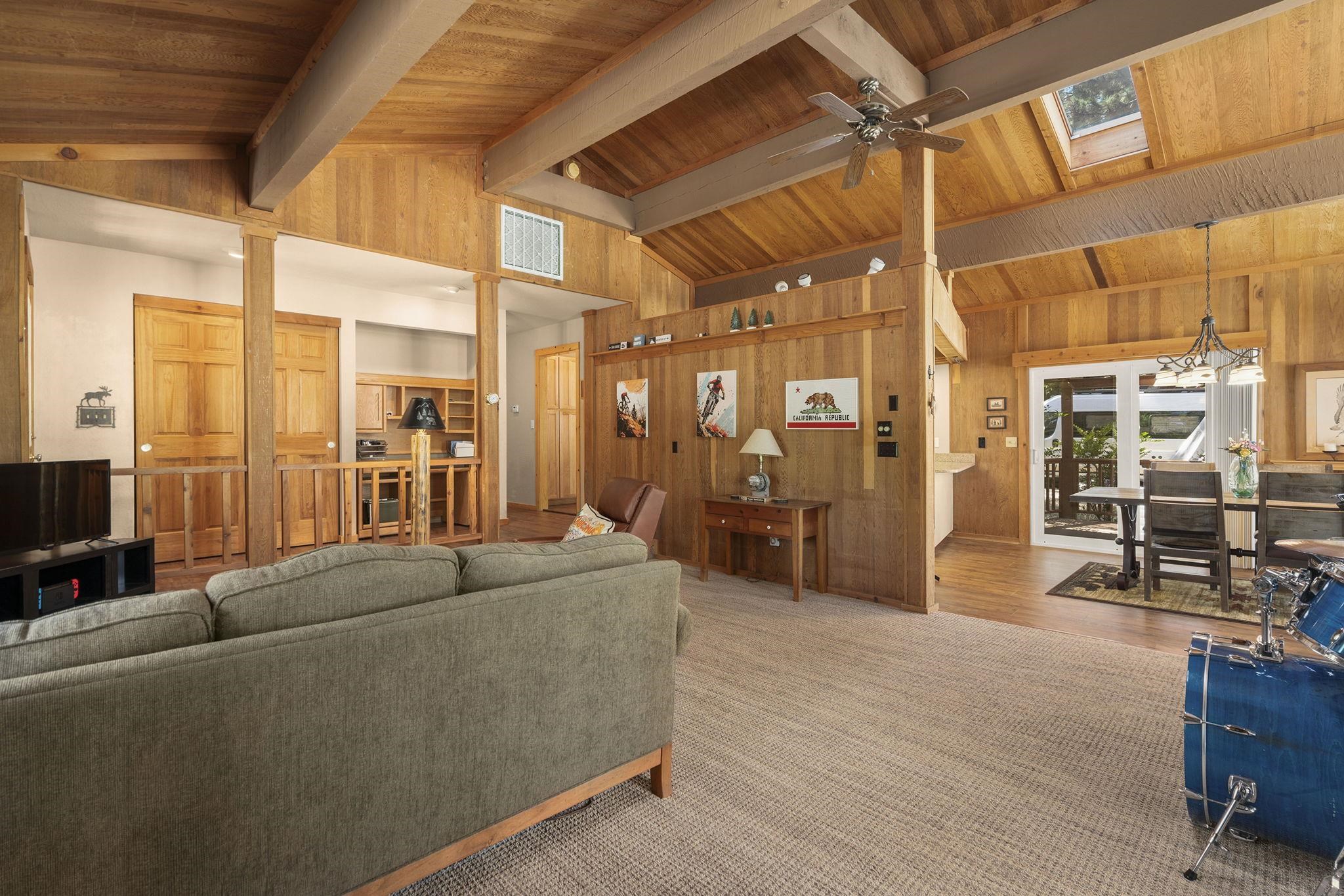 6 Hokan Trail Graeagle, CA 96103 - Photo 10 of 28 a living room with furniture a wooden floor and next to a window