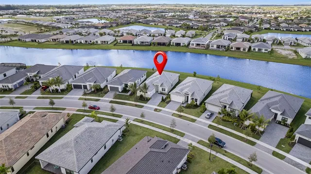 an aerial view of a city with ocean