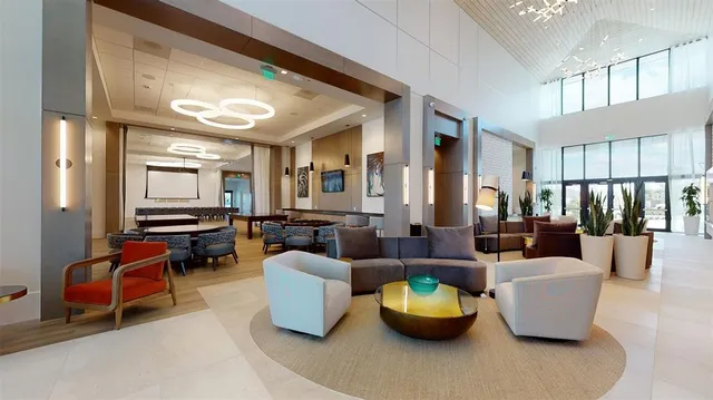 a living room with furniture fireplace and wooden floor