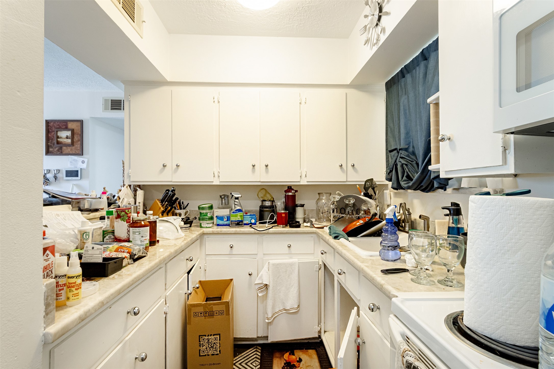 606 Enid Street, Unit 3 Houston, TX 77009 - Photo 23 of 42 a view of a kitchen with sink refrigerator and cabinets