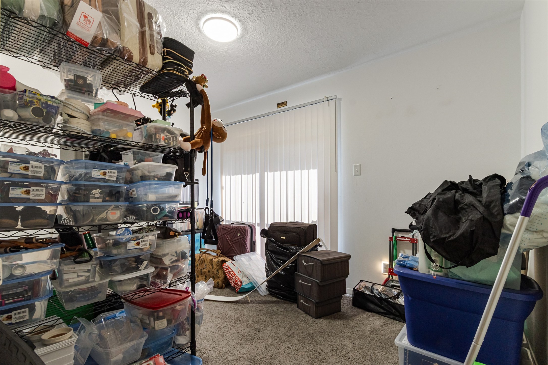 606 Enid Street, Unit 3 Houston, TX 77009 - Photo 26 of 42 a room with lots of chairs and a fan