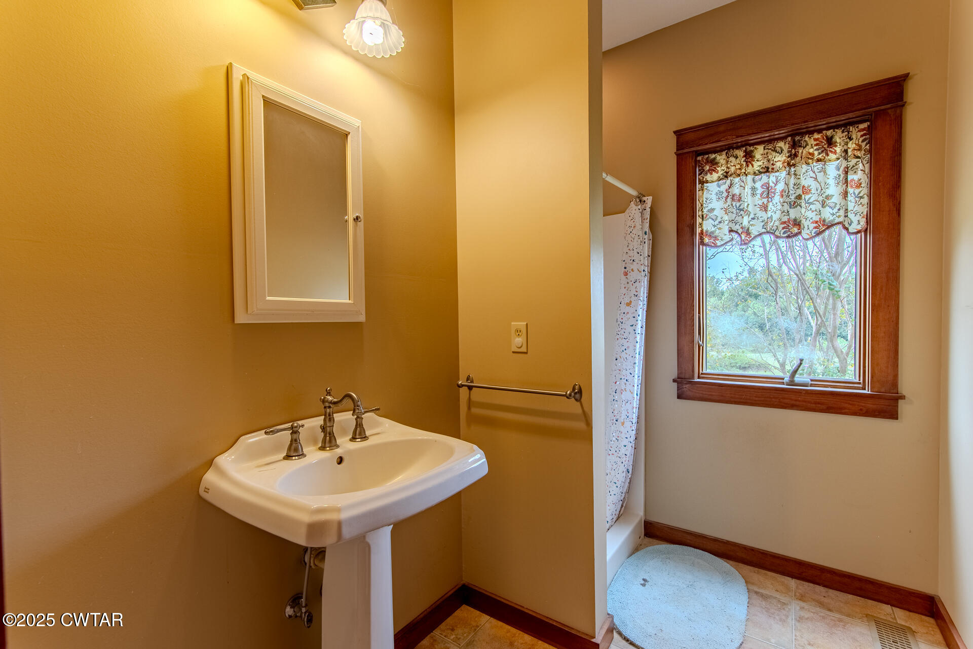 3554 Shades Bridge Road Greenfield, TN 38230 - Photo 29 of 49 a bathroom with a sink a toilet and mirror