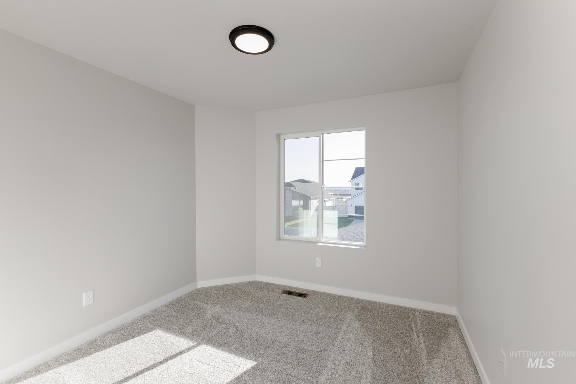 10574 West Teratai Street Star, ID 83669 - Photo 13 of 23 Empty room featuring carpet and baseboards
