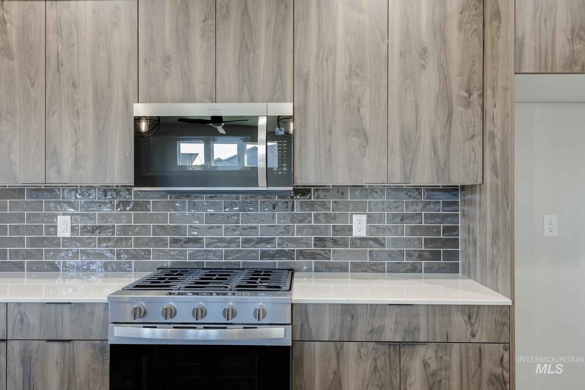 10574 West Teratai Street Star, ID 83669 - Photo 7 of 23 Kitchen featuring modern cabinets, stainless steel appliances, and light stone counters