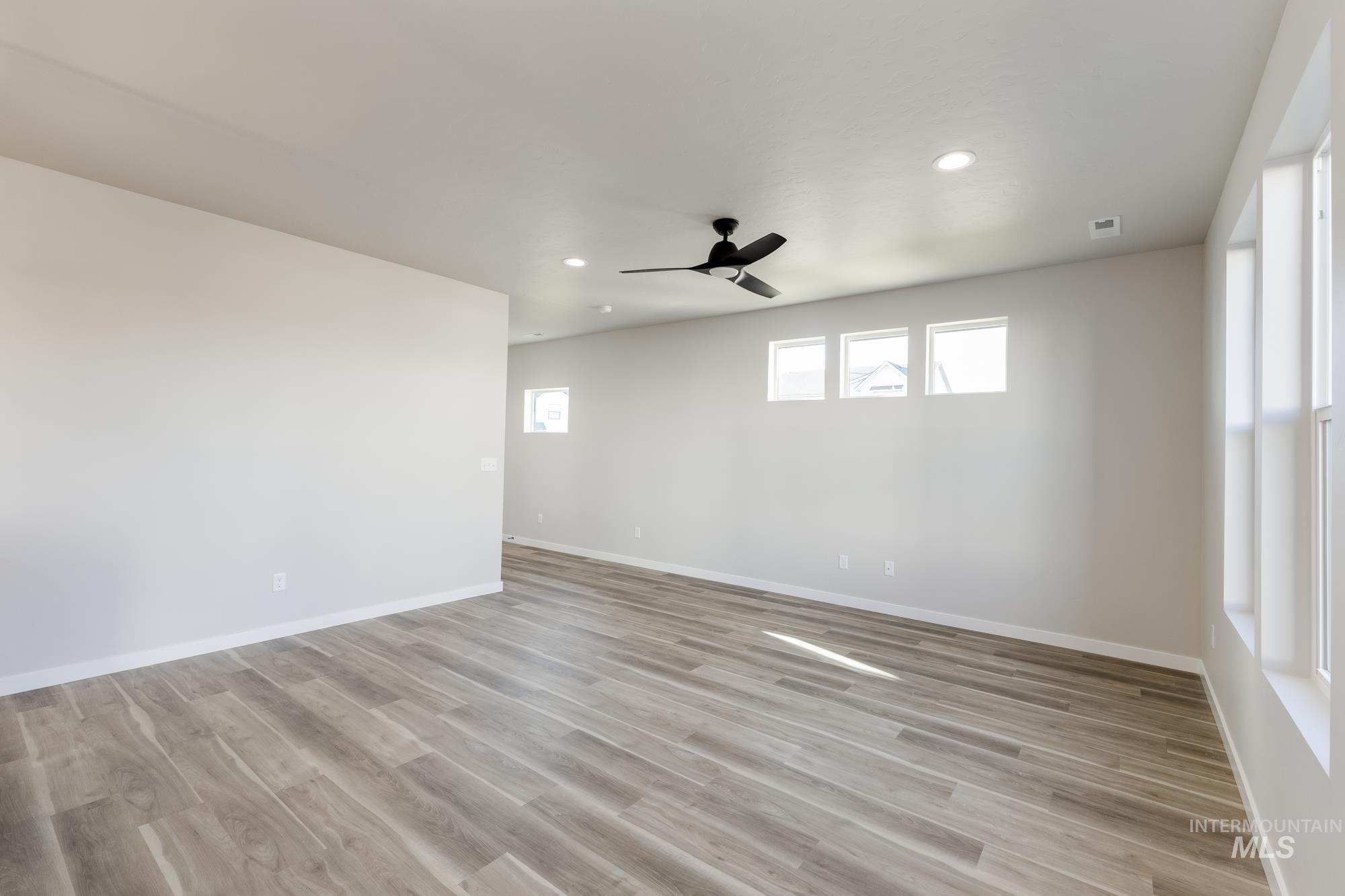 10574 West Teratai Street Star, ID 83669 - Photo 9 of 23 Spare room featuring light wood-style floors, recessed lighting, and ceiling fan