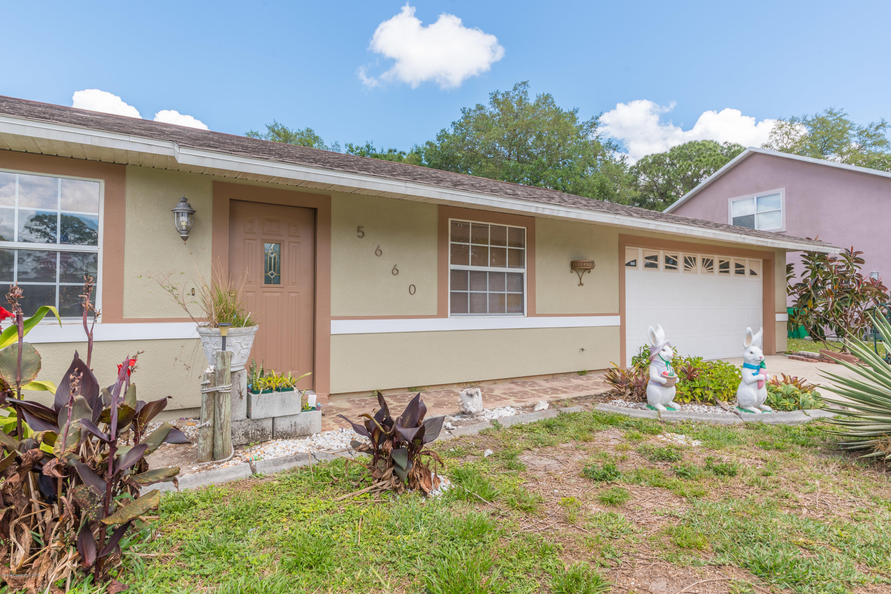5660 Banos Avenue Cocoa, FL 32927 - Photo 11 of 22 a front view of house with yard