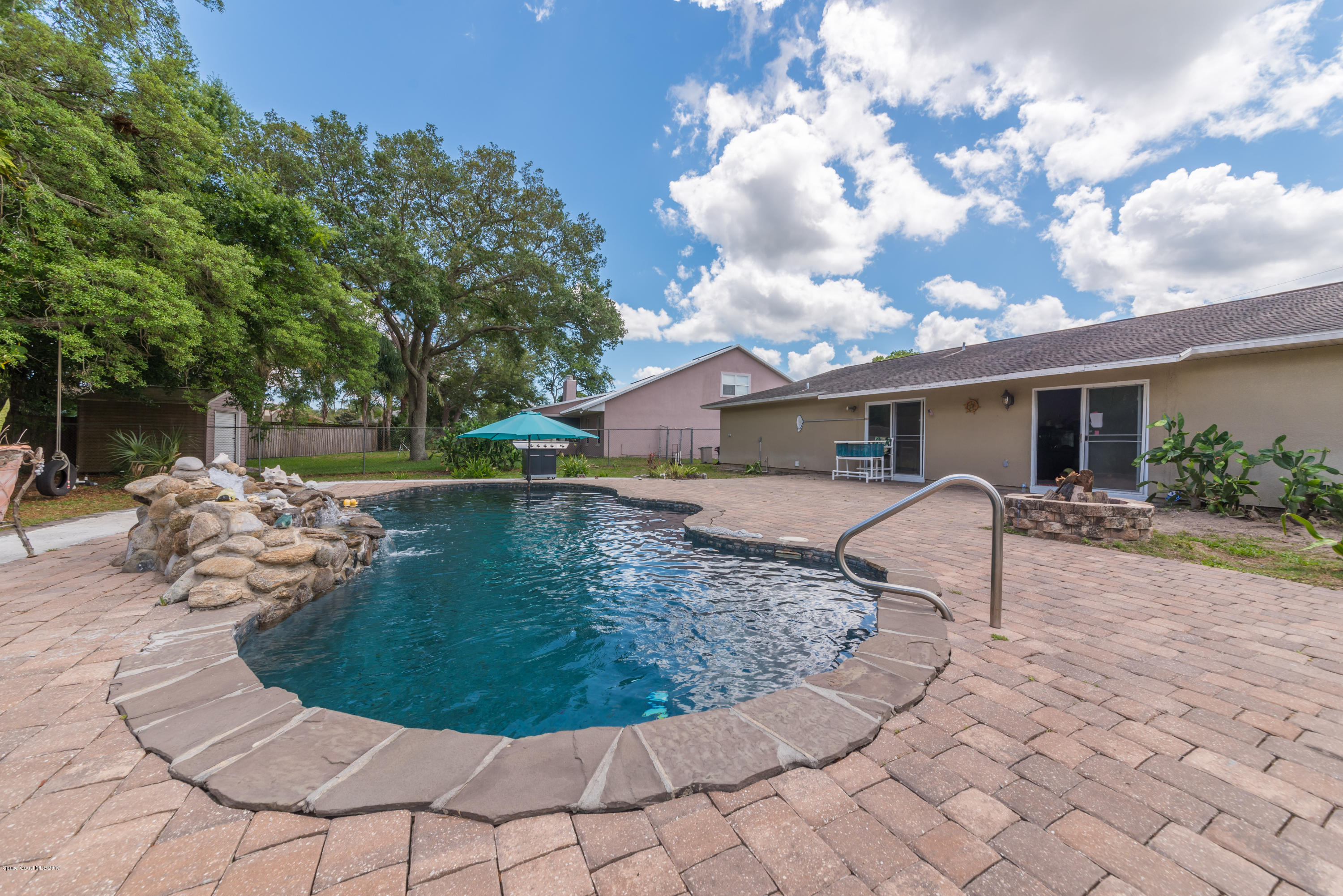 5660 Banos Avenue Cocoa, FL 32927 - Photo 5 of 22 a view of a house with a yard potted plants