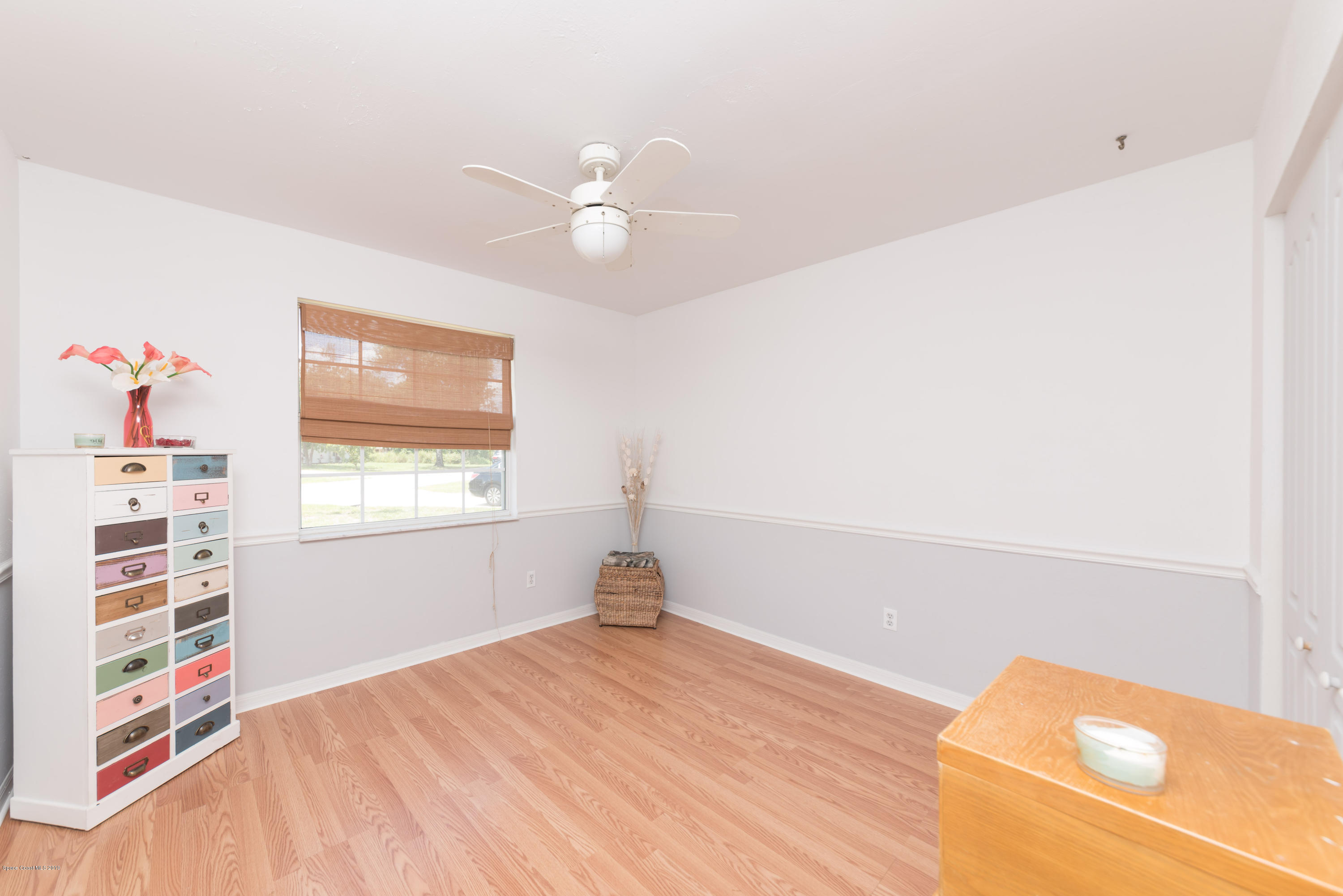 5660 Banos Avenue Cocoa, FL 32927 - Photo 6 of 22 a view of empty room with window and ceiling fan