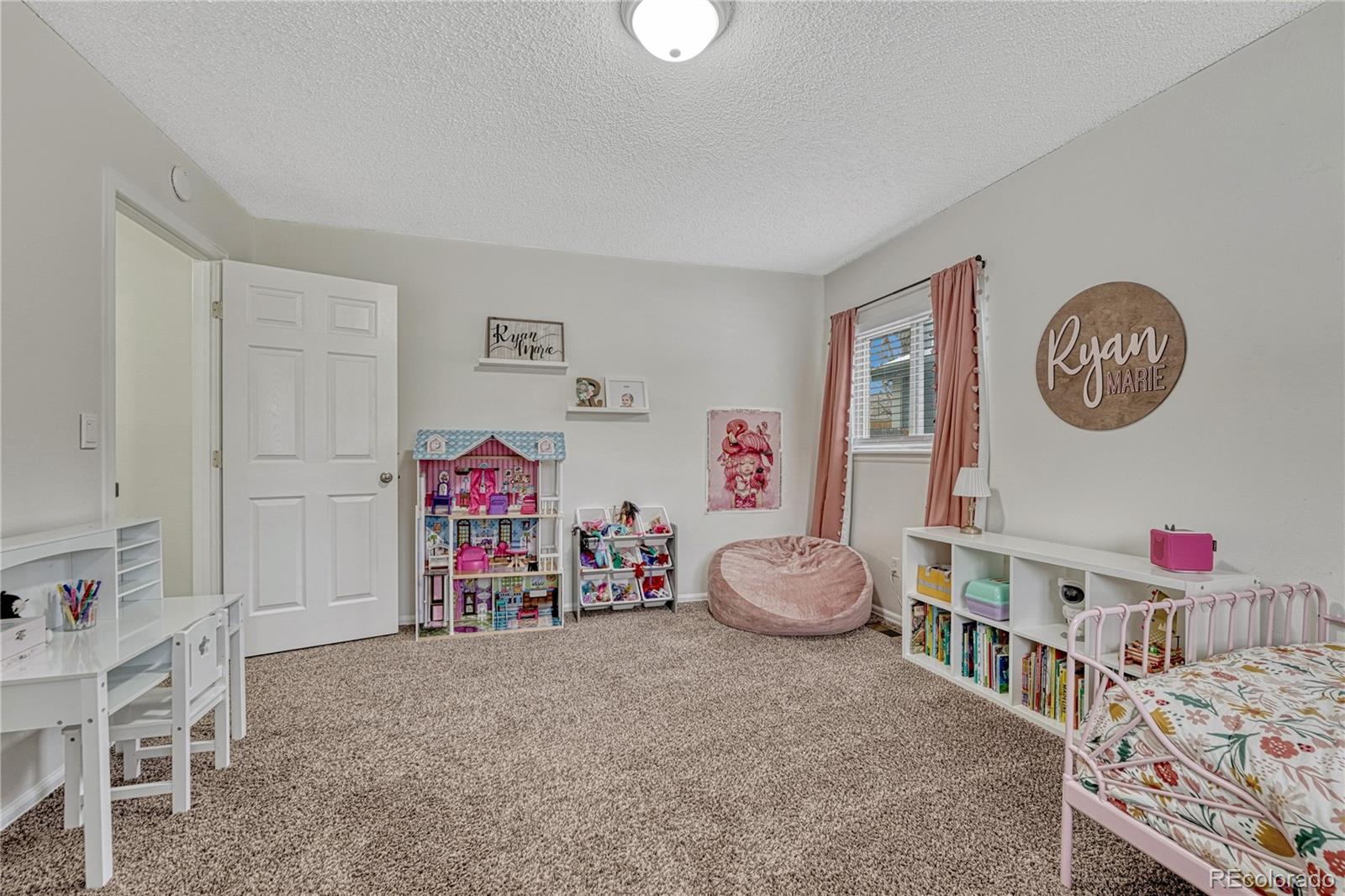 2935 Rolling Wood Loop Colorado Springs, CO 80918 - Photo 17 of 47 a bedroom with furniture and a baby crib