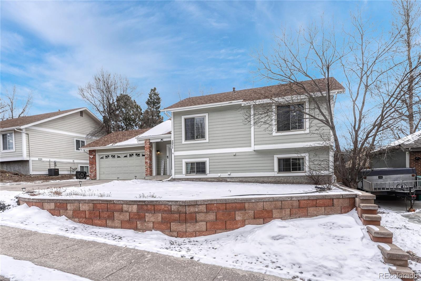 2935 Rolling Wood Loop Colorado Springs, CO 80918 - Photo 2 of 47 a view of house with outdoor space