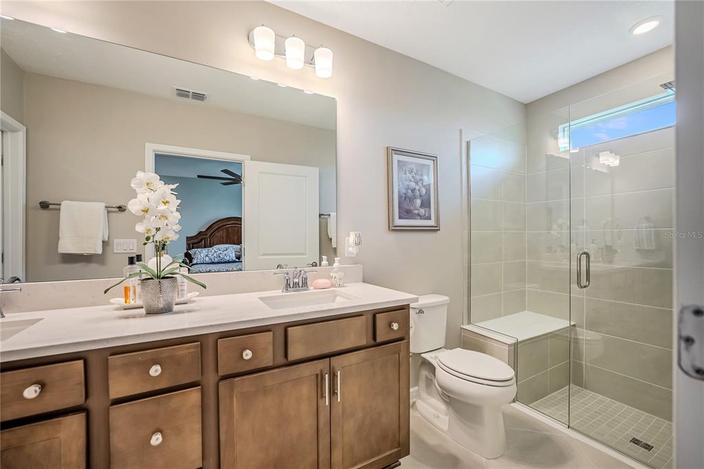 8344 Southwest 54th Loop Ocala, FL 34481 - Photo 13 of 36 a bathroom with a sink a toilet and shower