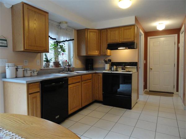 32 Hanson Road Charlton, MA 01507 - Photo 6 of 28 a kitchen with a sink a stove and cabinets