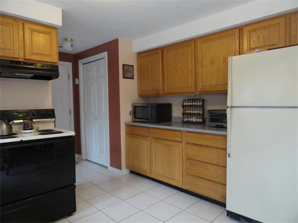 32 Hanson Road Charlton, MA 01507 - Photo 7 of 28 a kitchen with stainless steel appliances granite countertop a refrigerator a stove top oven a sink and dishwasher
