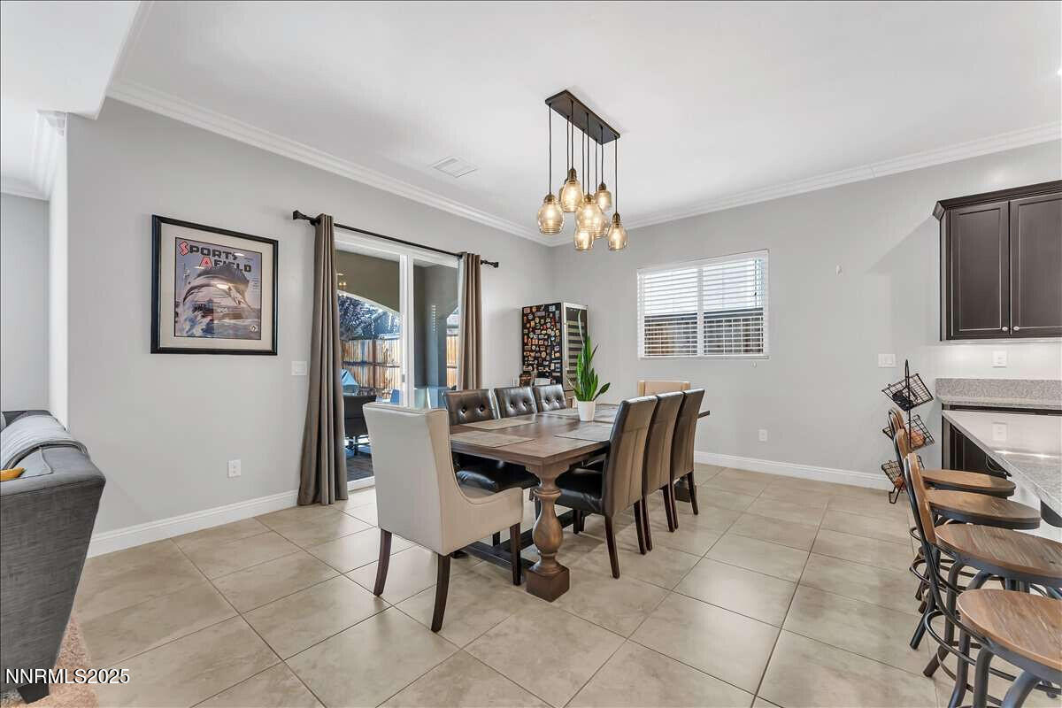1671 Crescent Pointe Court Reno, NV 89523 - Photo 13 of 44 a view of a dining room with furniture
