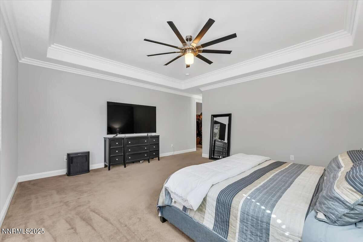 1671 Crescent Pointe Court Reno, NV 89523 - Photo 20 of 44 a bedroom with a bed and a flat screen tv