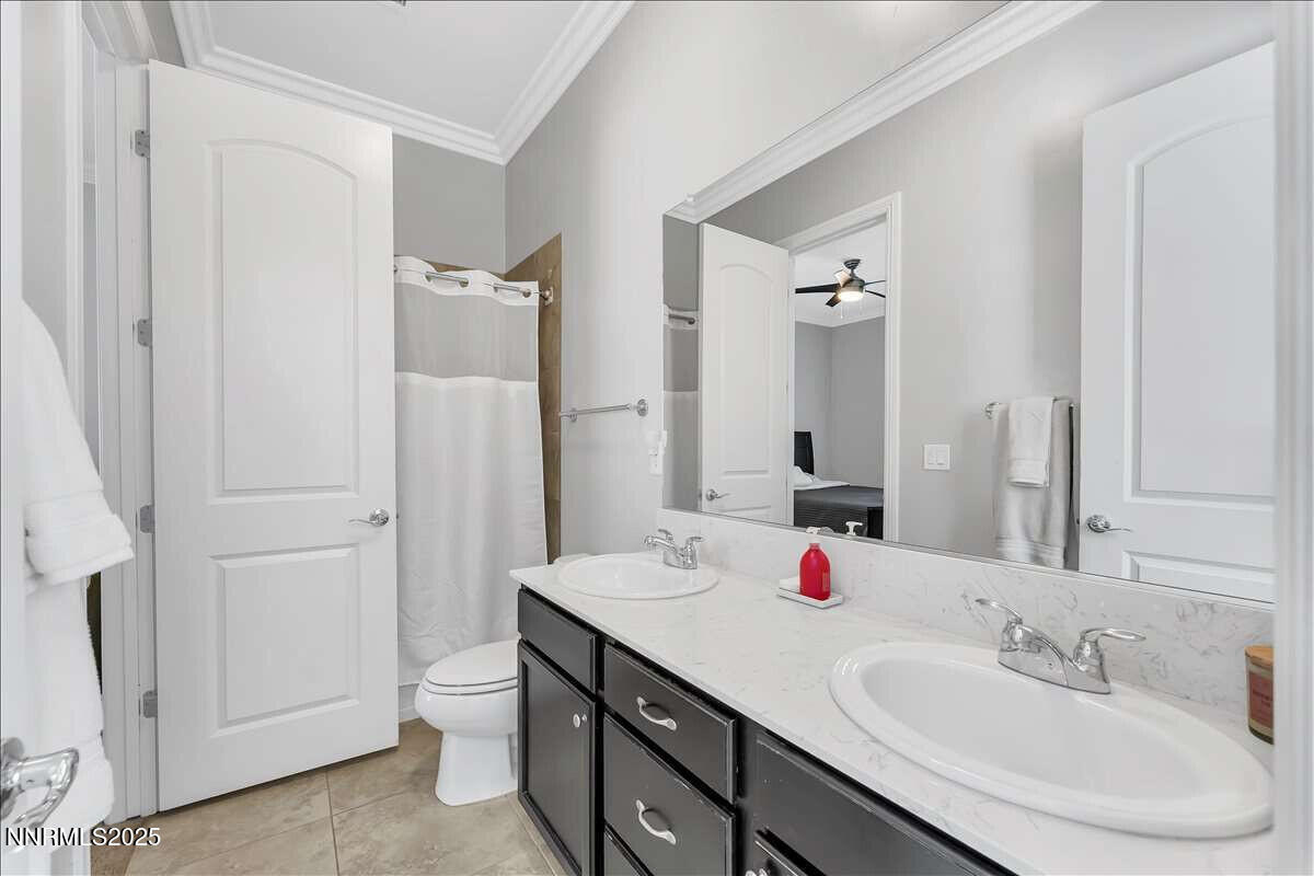 1671 Crescent Pointe Court Reno, NV 89523 - Photo 25 of 44 a bathroom with a double vanity sink mirror and double