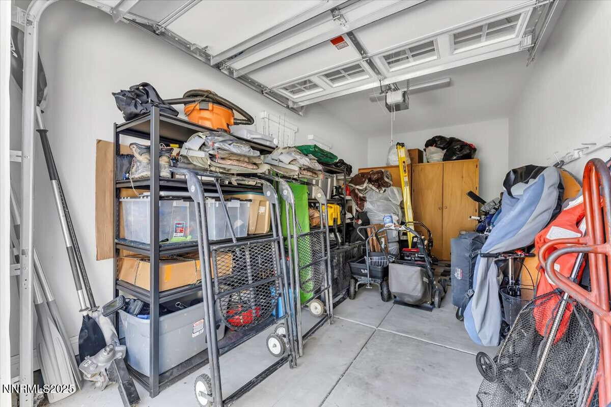 1671 Crescent Pointe Court Reno, NV 89523 - Photo 30 of 44 a view of walk in closet with clothes and shoes
