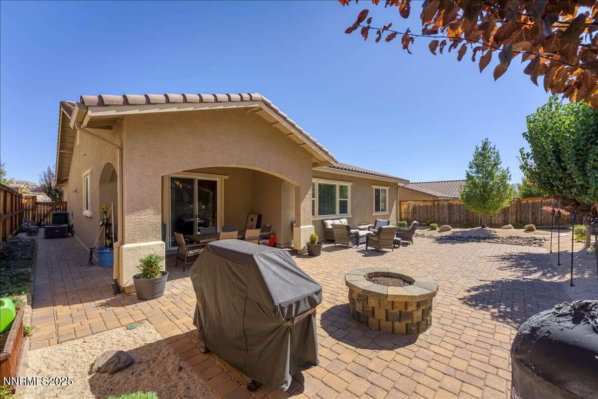 1671 Crescent Pointe Court Reno, NV 89523 - Photo 32 of 44 a view of a house with backyard and sitting area