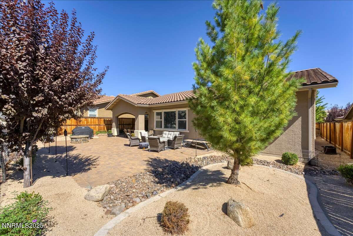 1671 Crescent Pointe Court Reno, NV 89523 - Photo 34 of 44 a view of a house with a yard covered in snow