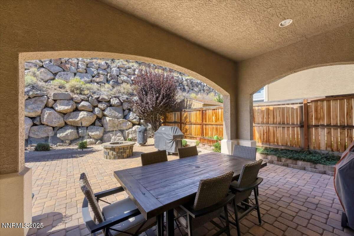 1671 Crescent Pointe Court Reno, NV 89523 - Photo 37 of 44 a dining room with furniture and wooden floor