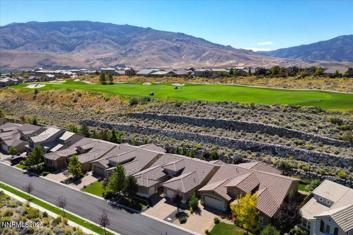 1671 Crescent Pointe Court Reno, NV 89523 - Photo 39 of 44 an aerial view of a house and mountain view