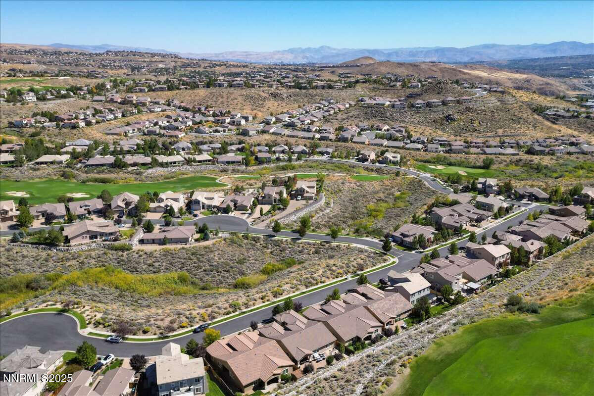1671 Crescent Pointe Court Reno, NV 89523 - Photo 40 of 44 an aerial view of a city with lots of residential buildings