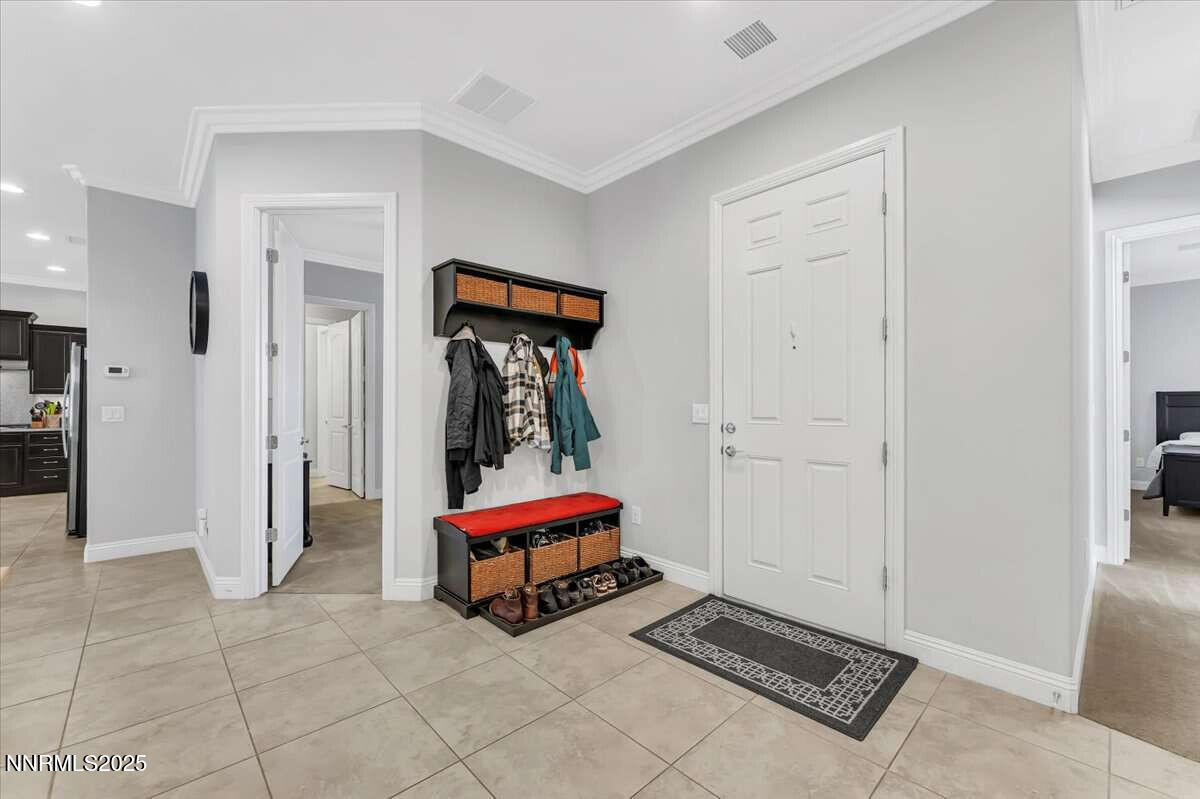 1671 Crescent Pointe Court Reno, NV 89523 - Photo 6 of 44 a room with a table and a lamp