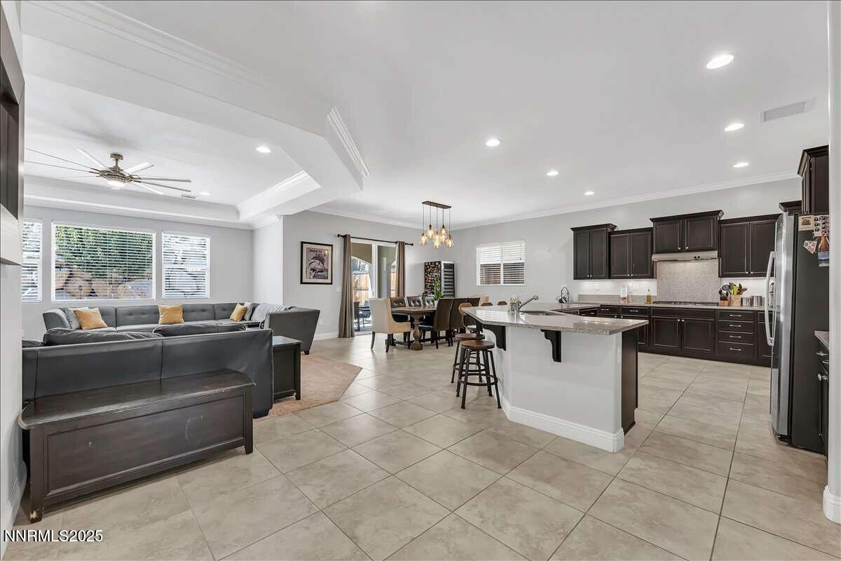 1671 Crescent Pointe Court Reno, NV 89523 - Photo 7 of 44 a large kitchen with lots of counter space and furniture