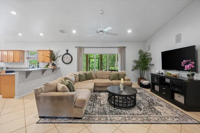 a kitchen with stainless steel appliances granite countertop a refrigerator and a stove