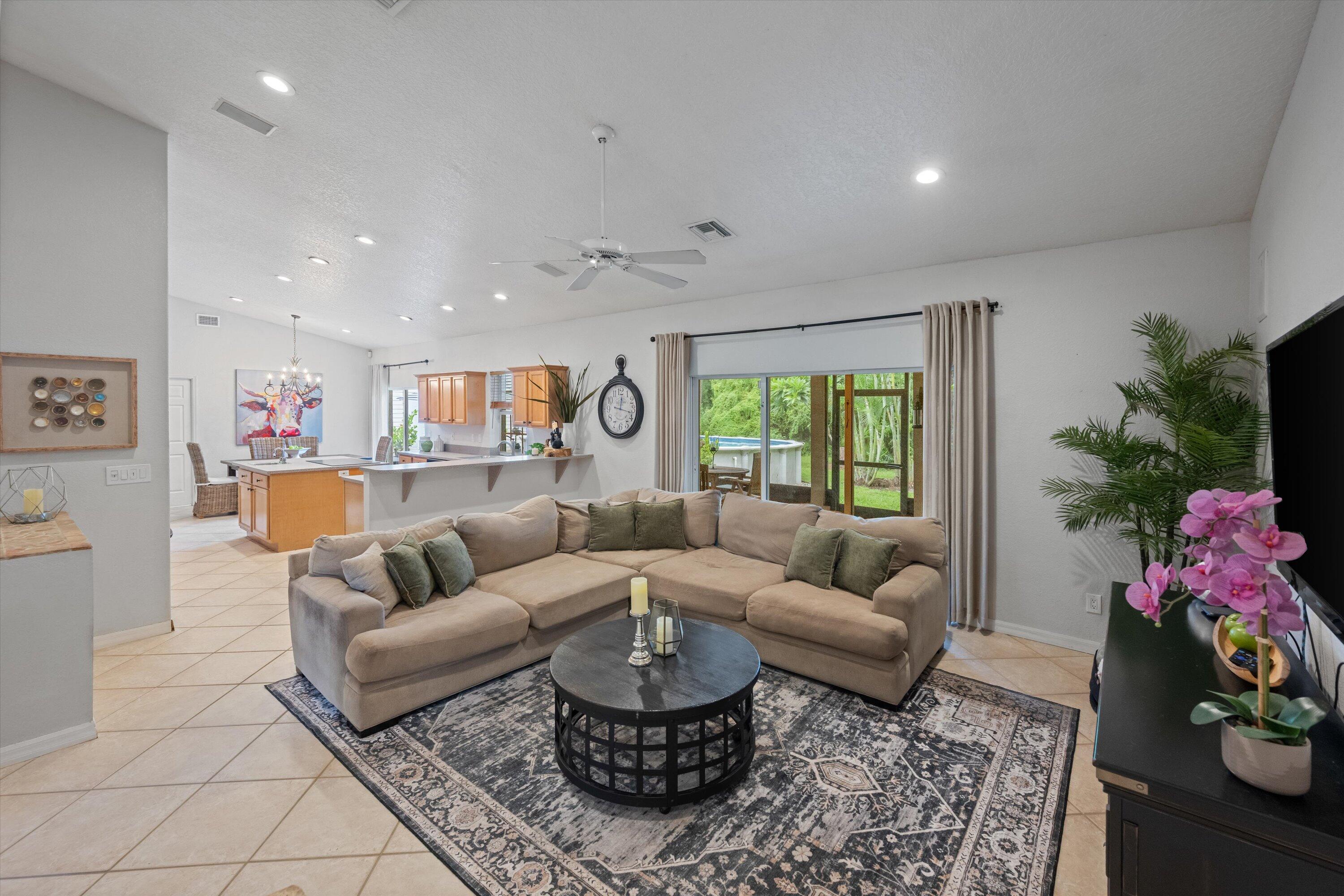 10771 154th Road North Jupiter, FL 33478 - Photo 14 of 87 a living room with furniture and a large window