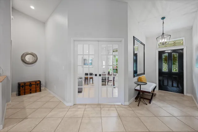 a spacious bathroom with a shower sink and mirror